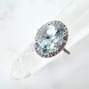 Oval Aquamarine diamond halo ring in white gold