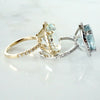 side view Oval Aquamarine diamond halo ring in white and yellow gold